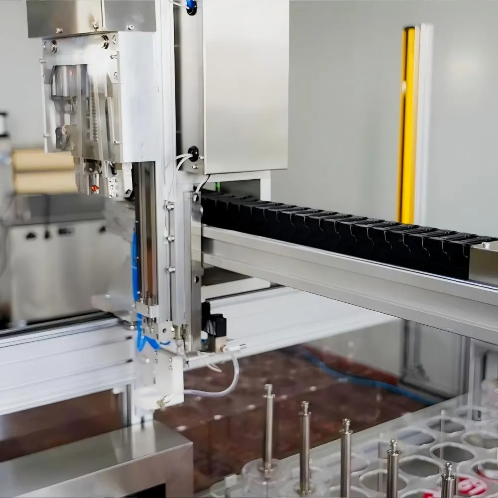 Close-up of automatic dispensing head and linear motion system